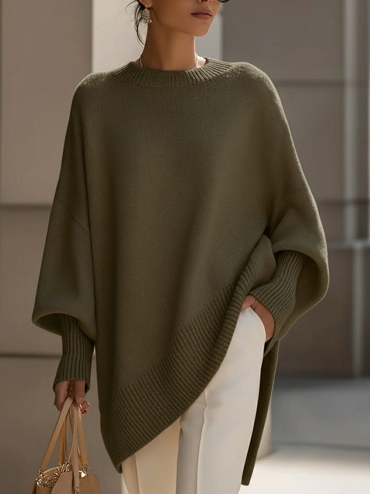 Warm & cozy oversized women's cape sweater poncho, an elegant essential for comfortable autumn fashion.