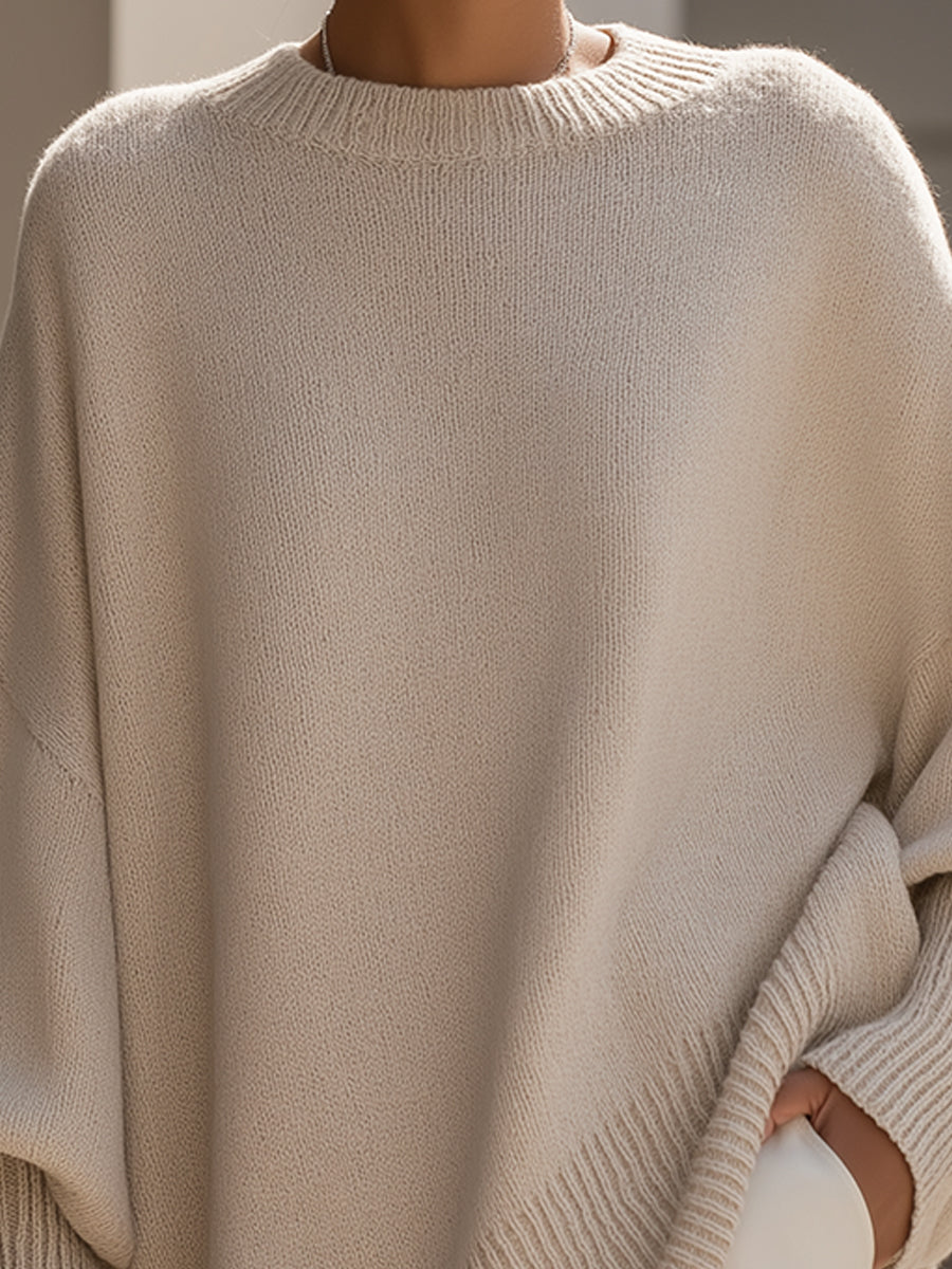 Cozy oversized women's poncho sweater with elegant batwing sleeves, ideal for comfortable autumn fashion.