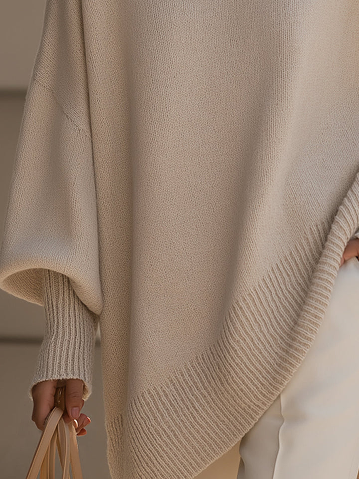 Versatile women's cape sweater poncho, a chic and cozy layering piece for elegant fall style.