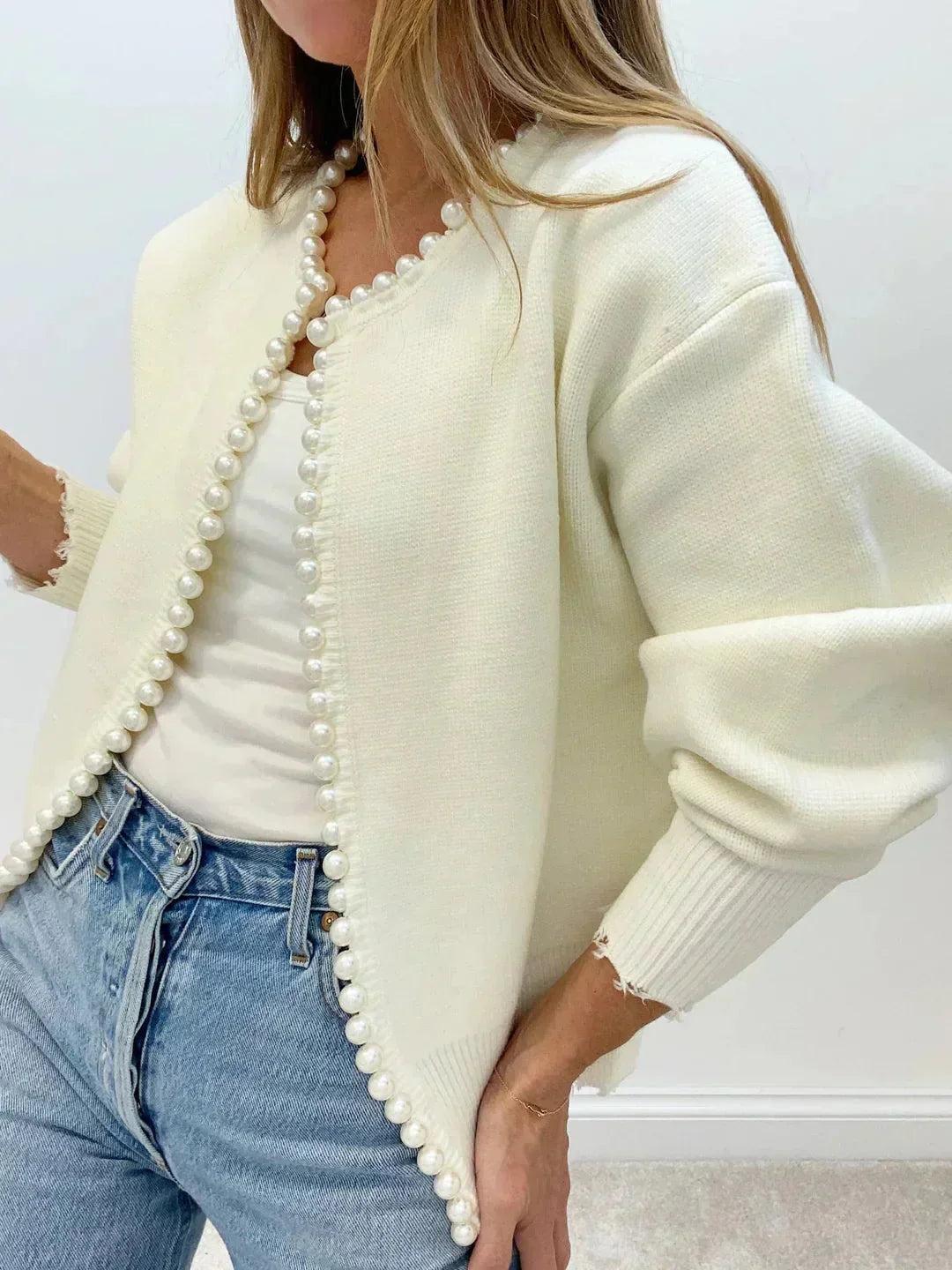 Women's elegant pearl trim cardigan sweater, long sleeve, round neck for chic sophisticated style.
