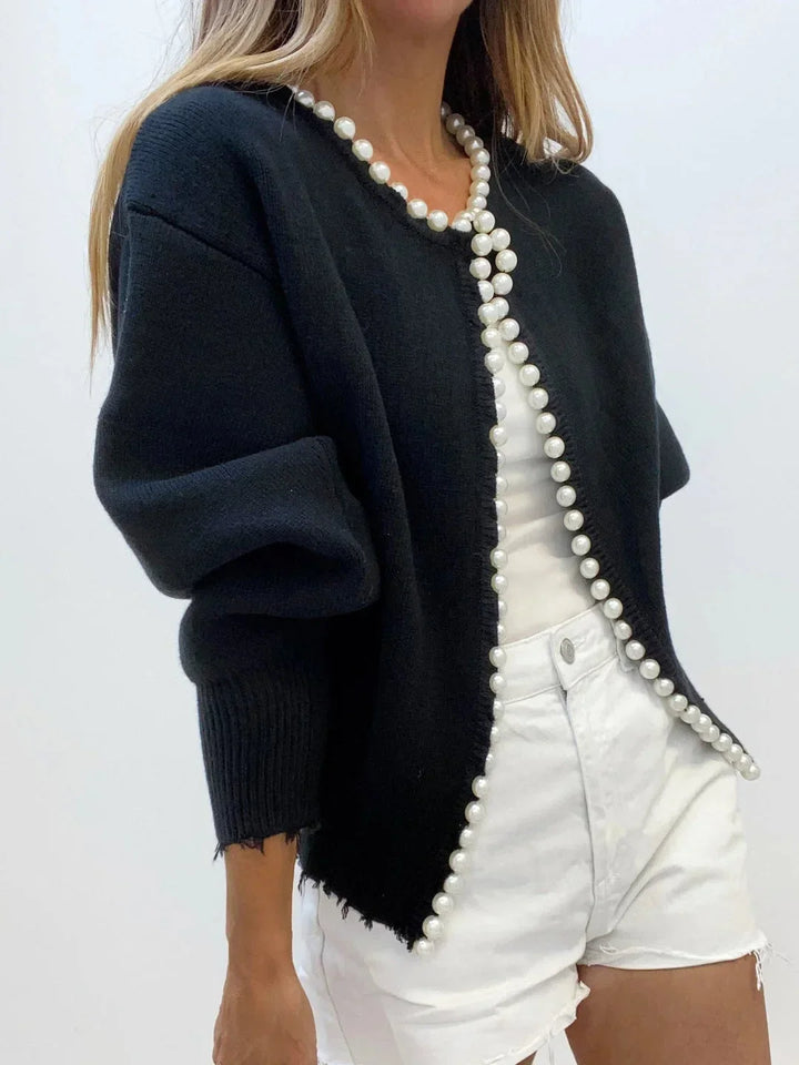 Chic women's pearl trim cardigan for elegant layering. Sophisticated, long sleeve fashion sweater.