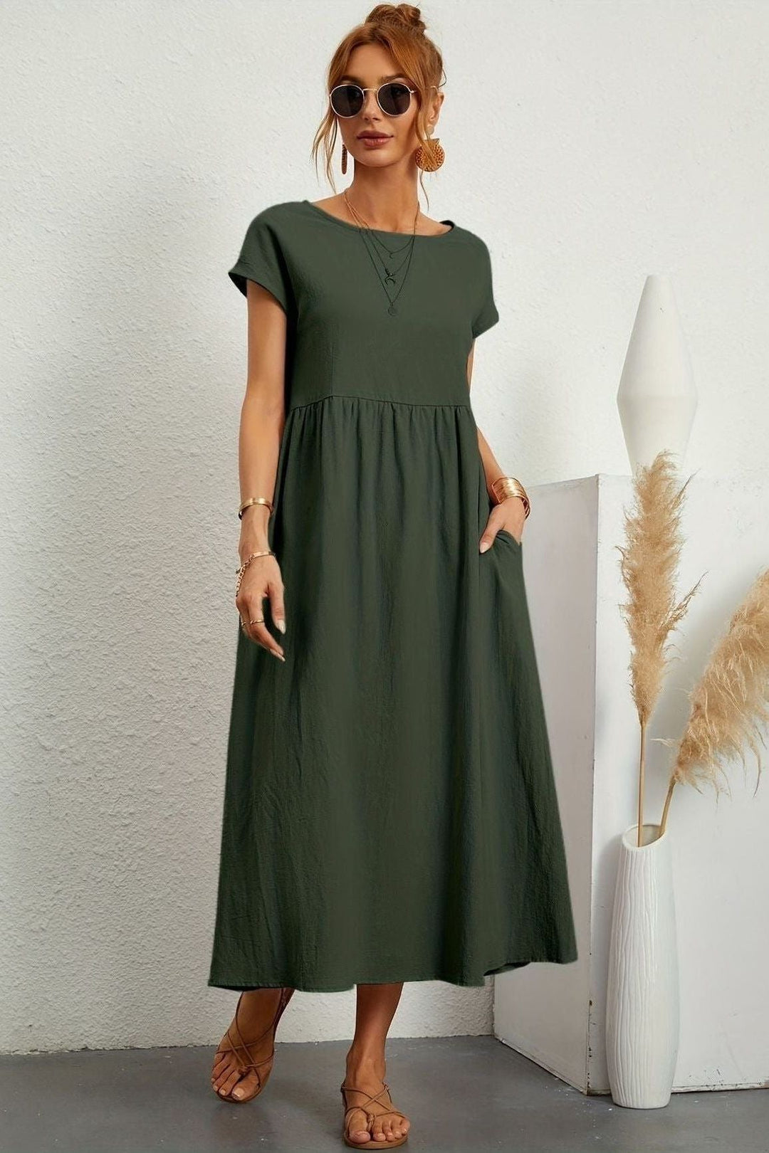 Women's elegant pleated midi dress for effortless style & comfort. Perfect for spring/summer fashion.