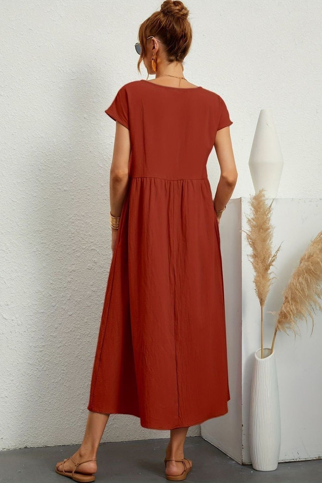 Modest & elegant women's pleated midi dress. Ideal for spring fashion, offering effortless style.