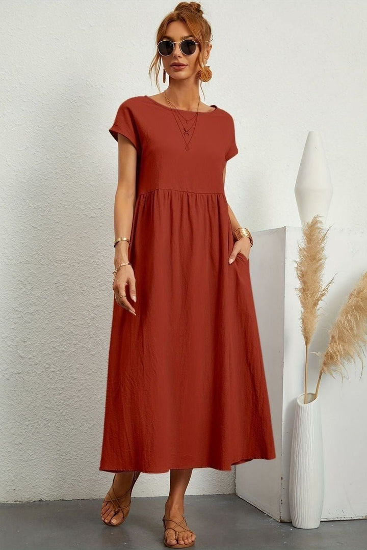 Comfortable pleated midi dress for women, featuring an elegant design. Perfect for summer style.