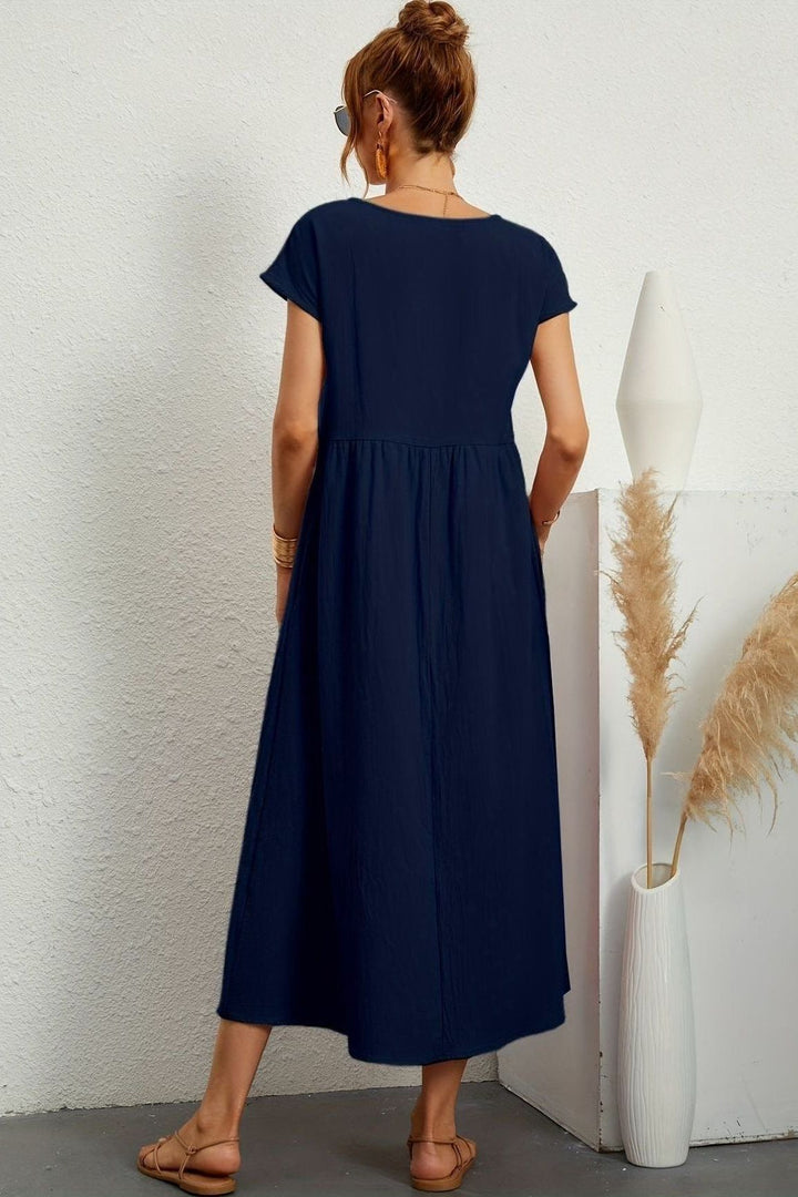 Women's elegant pleated midi dress, designed for effortless style & comfort. Spring/summer essential.