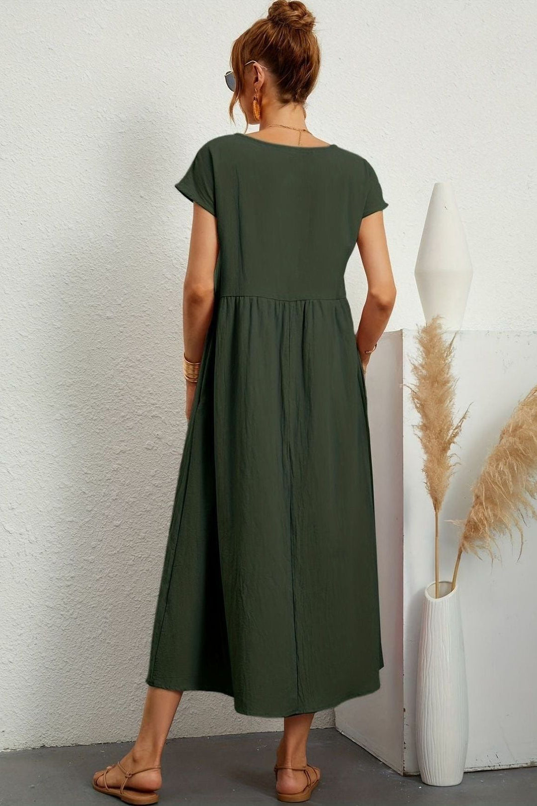 Modest pleated midi dress for women, ideal for spring and summer events. Effortless and stylish.