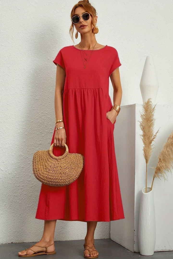 Elegant pleated midi dress for women, perfect for effortless spring fashion and summer comfort.