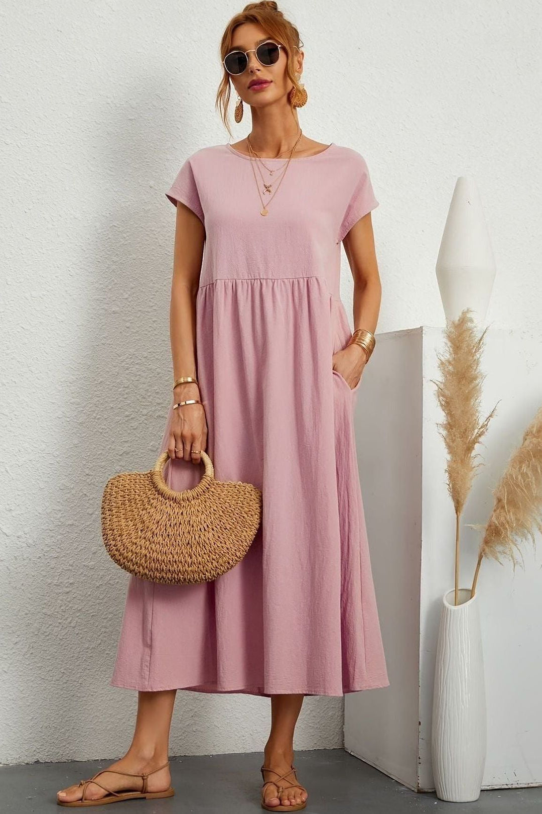 Comfortable pleated midi dress for women, featuring an elegant design. Perfect for summer style.