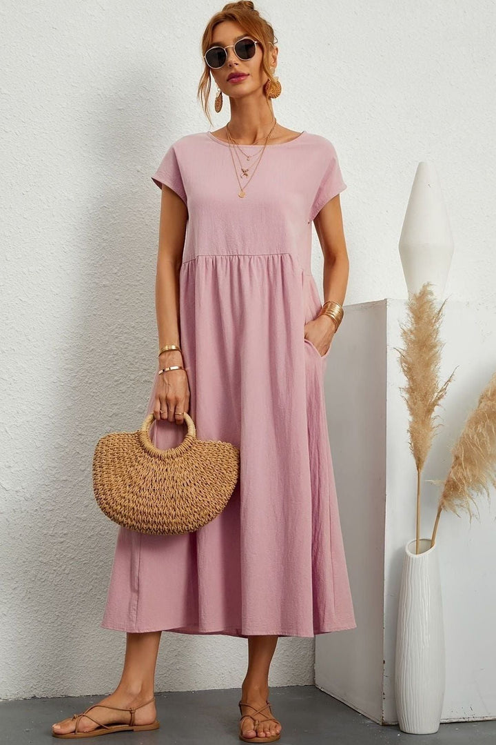 Comfortable pleated midi dress for women, featuring an elegant design. Perfect for summer style.