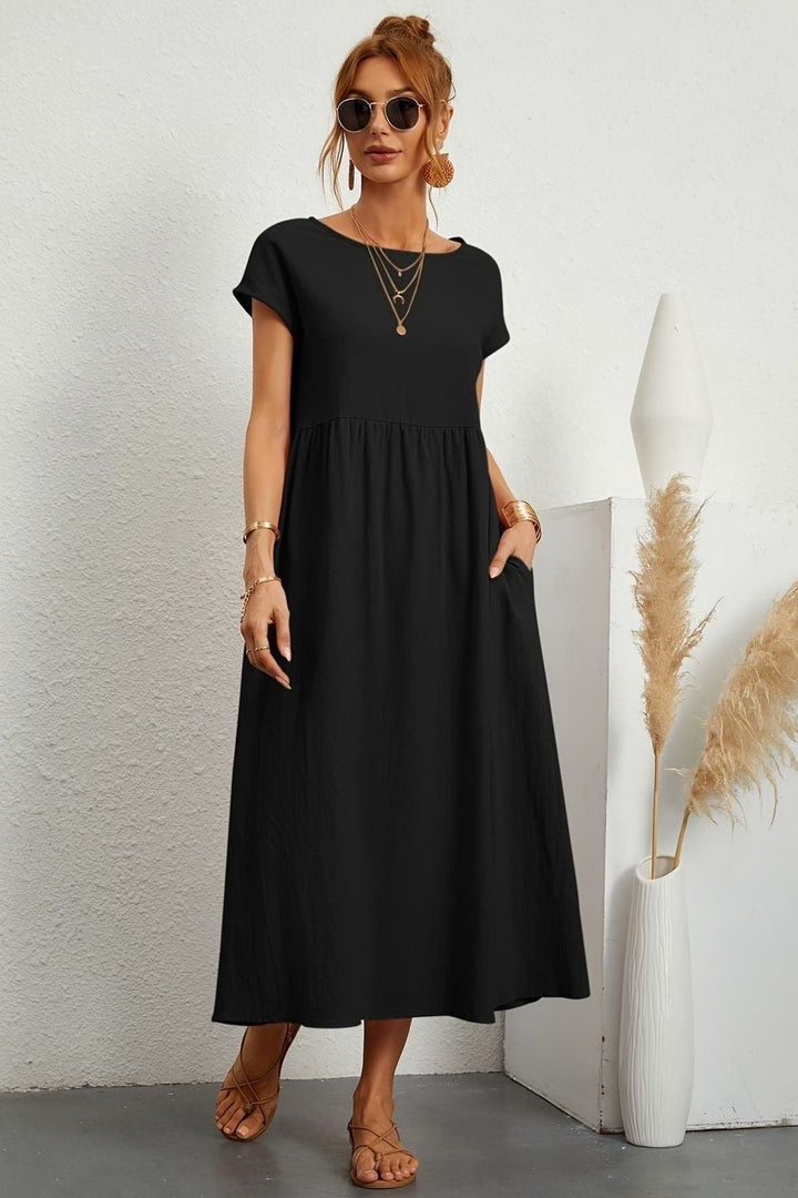 Modest pleated midi dress for women, ideal for spring fashion & summer events. Effortless style.