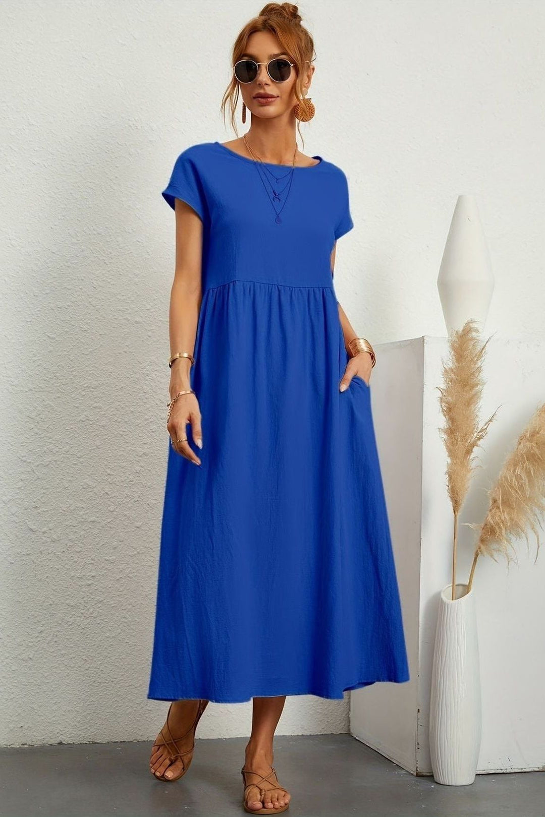 Effortless style with this women's pleated midi dress. Elegant & comfortable for spring fashion.