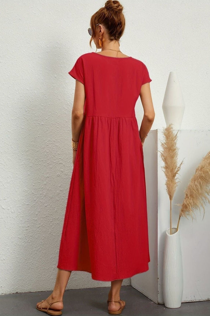 Chic women's midi dress, elegantly pleated for versatile and comfortable wear. A perfect summer dress.
