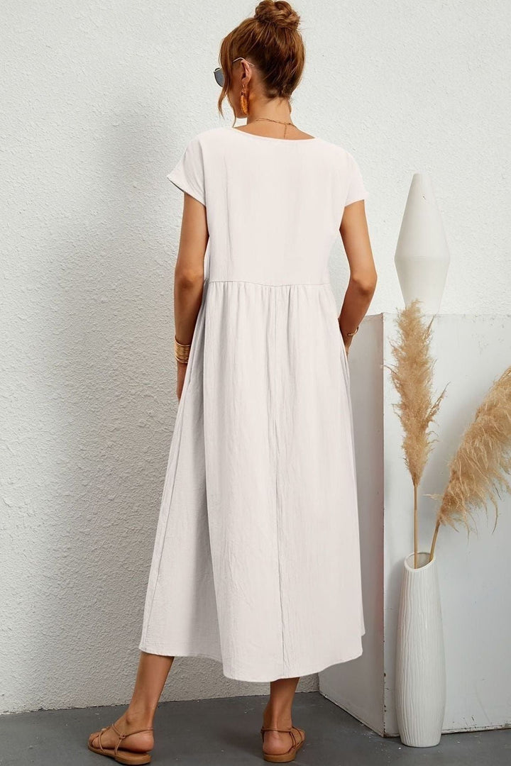 Stylish & comfortable women's elegant pleated midi dress. Versatile for day or evening wear.