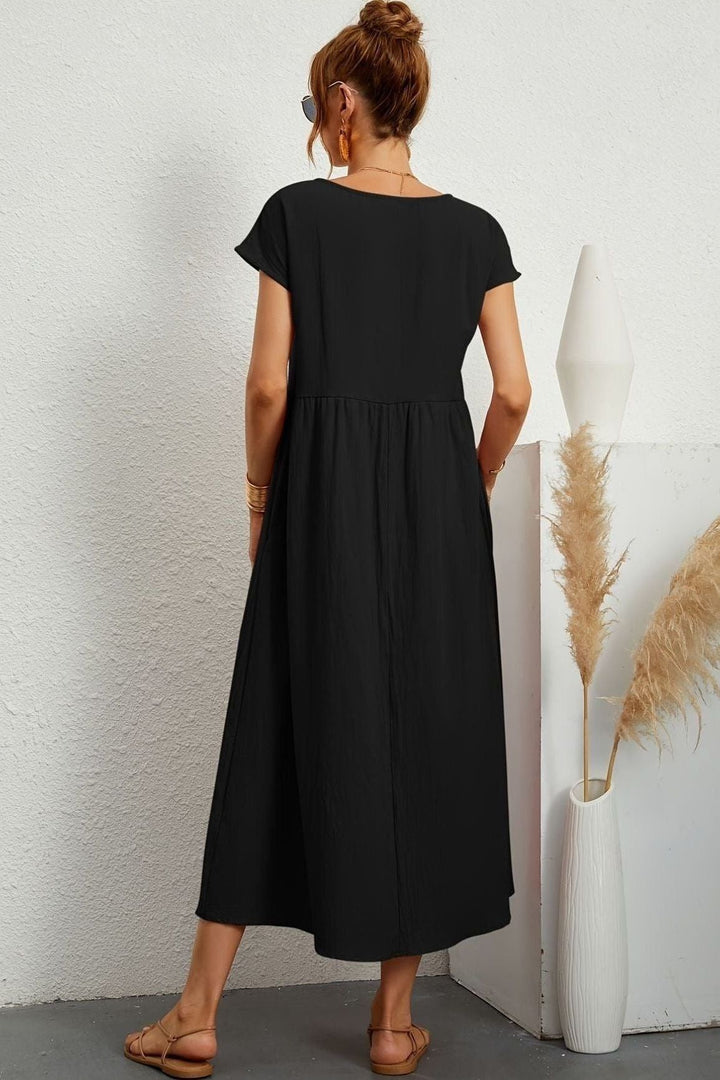 Elegant pleated midi dress for women, perfect for effortless spring fashion and summer comfort.