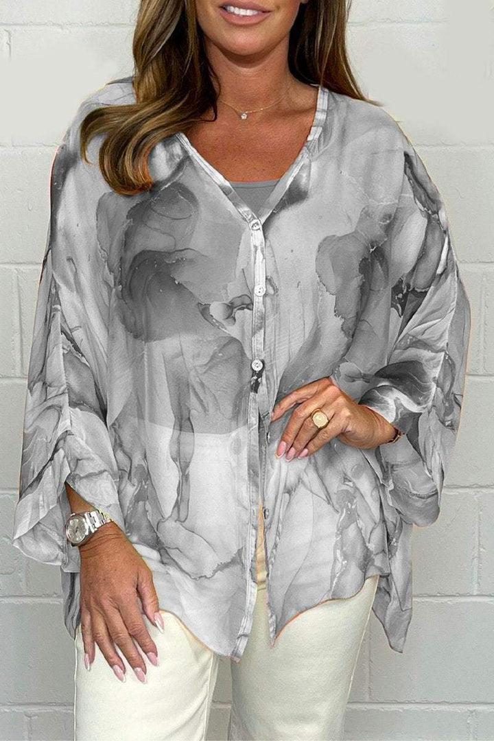 Women's elegant printed blouse, relaxed fit, perfect for everyday style. Stylish summer fashion top.