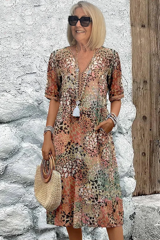 Women's elegant printed midi dress with a flattering, flowing style perfect for spring events.
