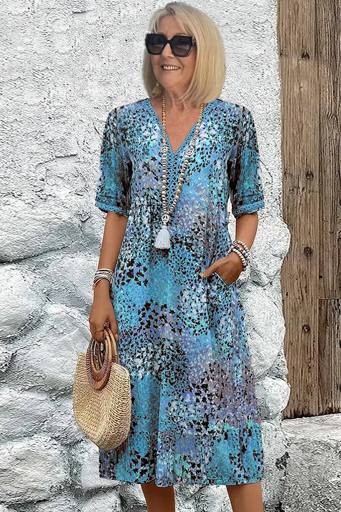 Flowy spring midi dress for women, featuring a flattering fit and elegant print, ideal for any occasion.