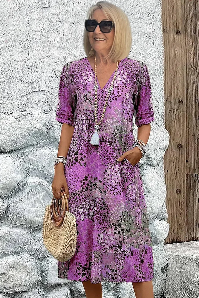 From the Spring Dress Collection: a flattering, flowy women's midi dress with an elegant, vibrant print.