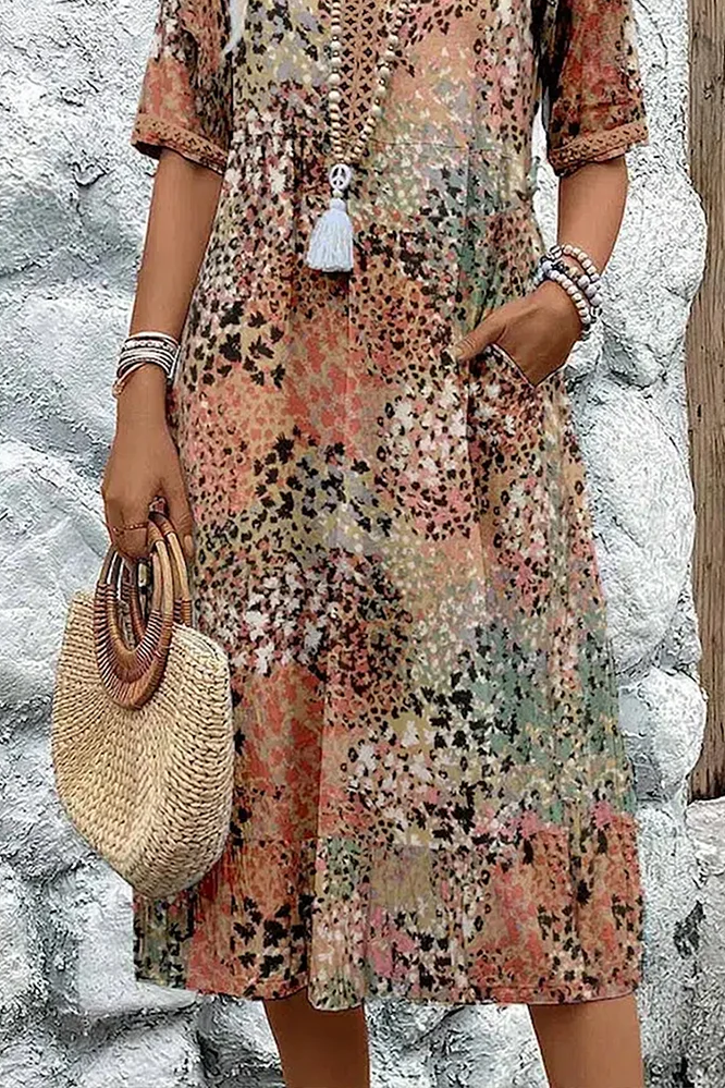 Women's elegant printed midi dress. Flattering, flowy spring style. Perfect casual or party fashion.