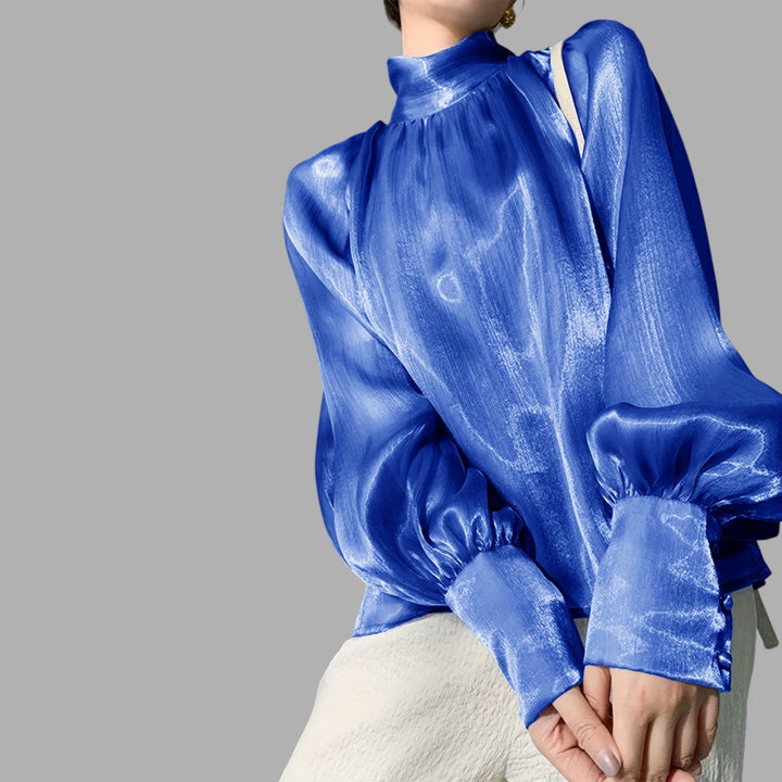 Versatile women's blouse featuring elegant puff sleeves, great for smart casual and work style.