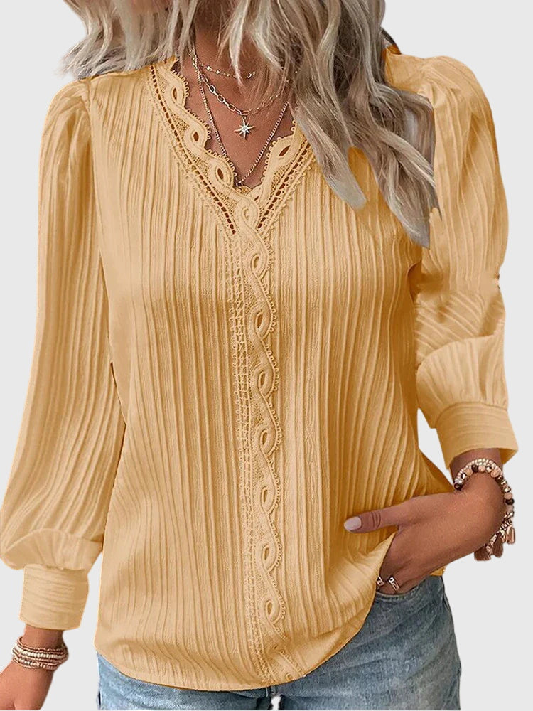 Women's elegant pullover blouse, a sophisticated long sleeve top for versatile everyday elegance.