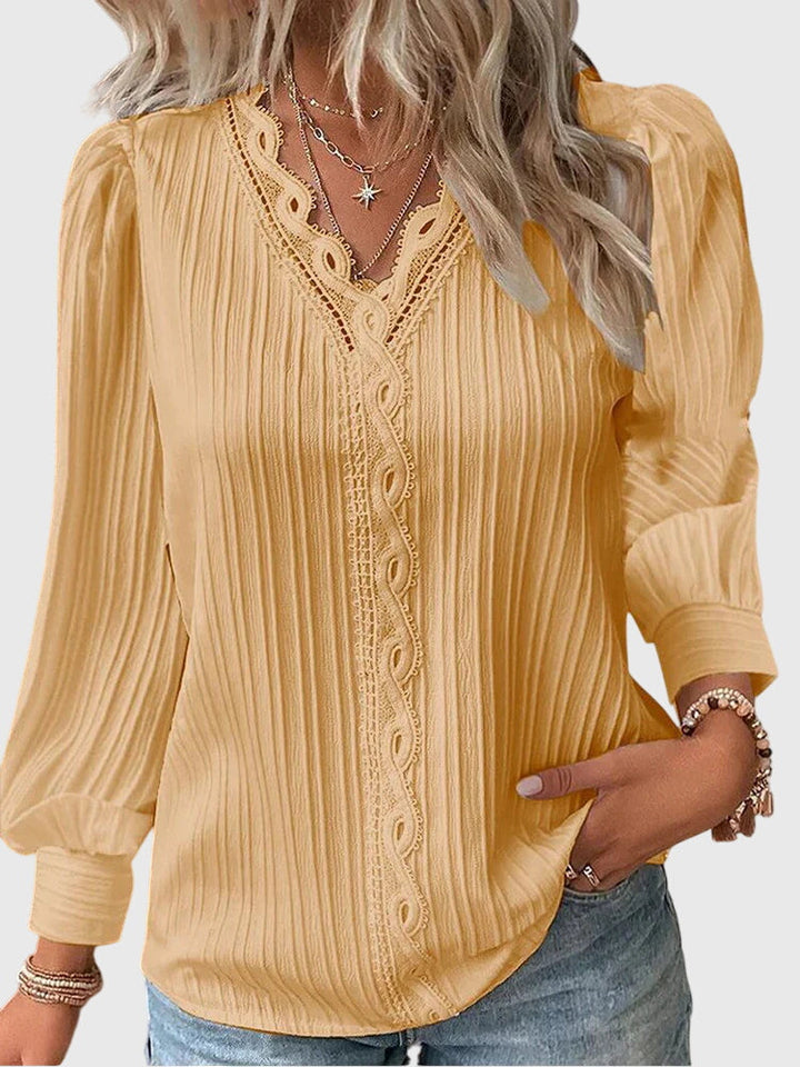 Women's elegant pullover blouse, a sophisticated long sleeve top for versatile everyday elegance.