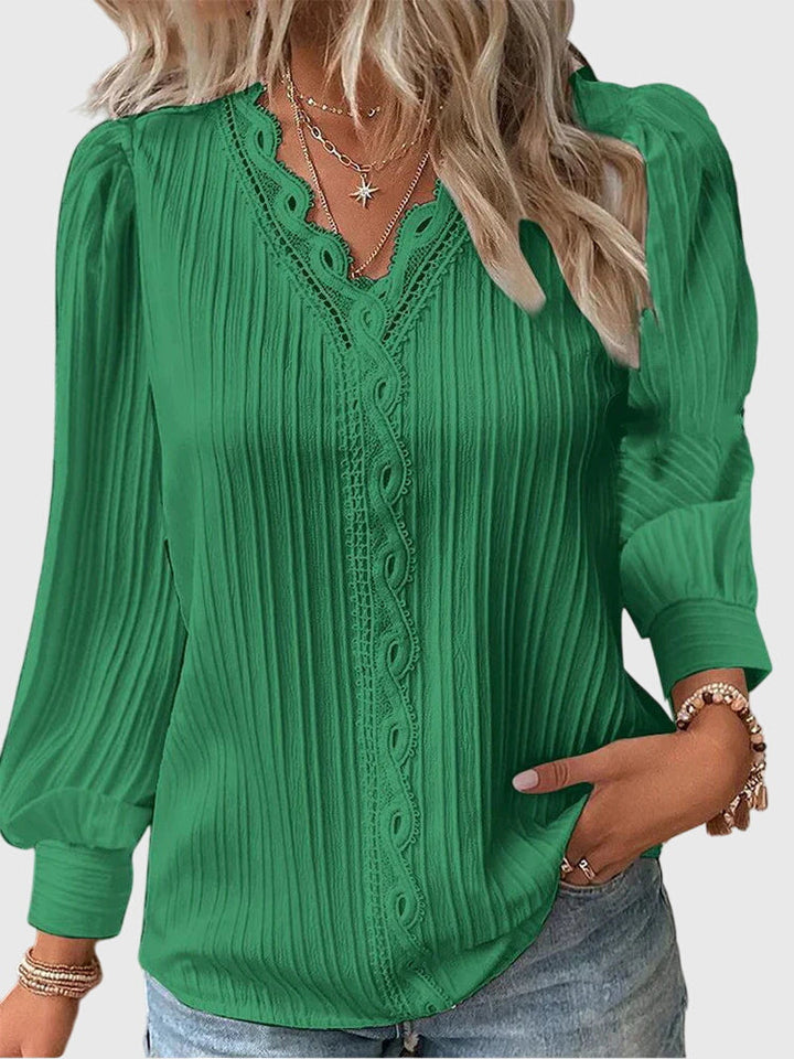 Comfortable women's long sleeve pullover blouse, a stylish fashion staple for casual chic or office attire.