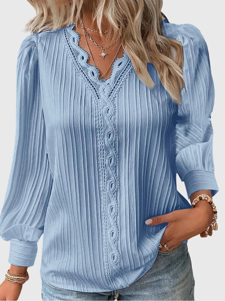 Stylish women's elegant pullover blouse with long sleeves, a comfortable shirt for sophisticated fashion.