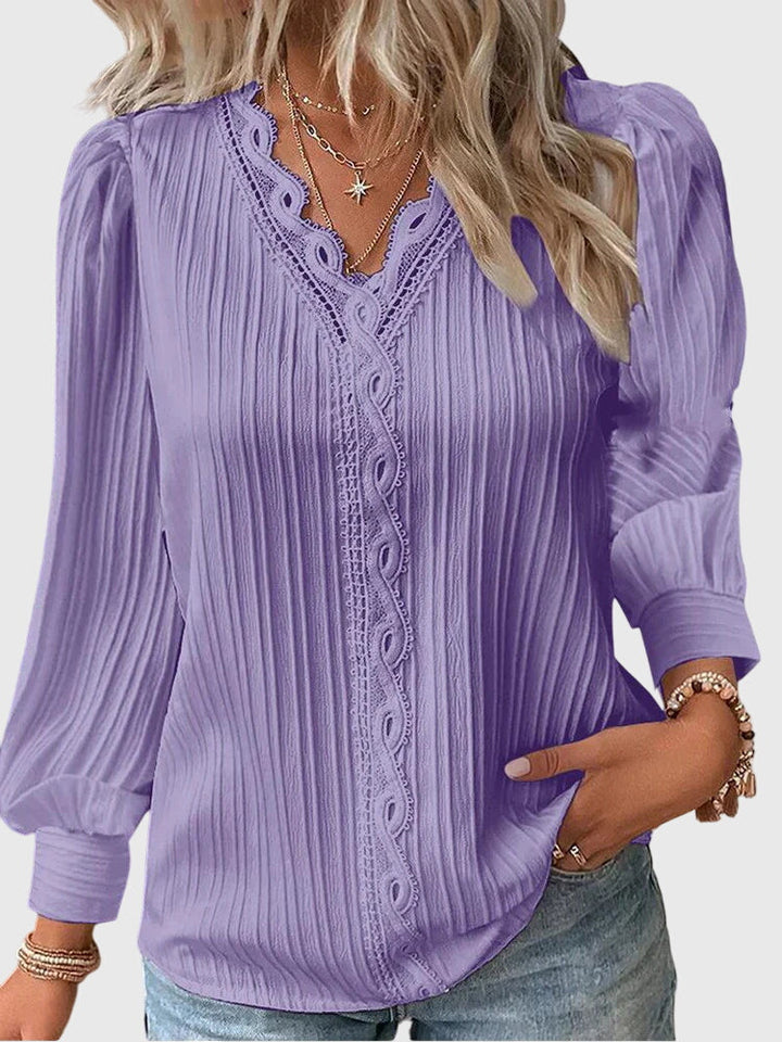 Elegant women's pullover blouse, a versatile long sleeve top that's a fashion staple for any occasion.