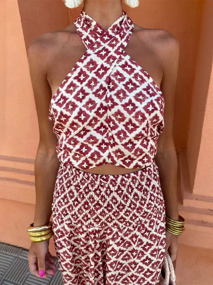 Chic burgundy printed halter maxi dress for women. Elegant formal wear, ideal as a cocktail or wedding guest dress.