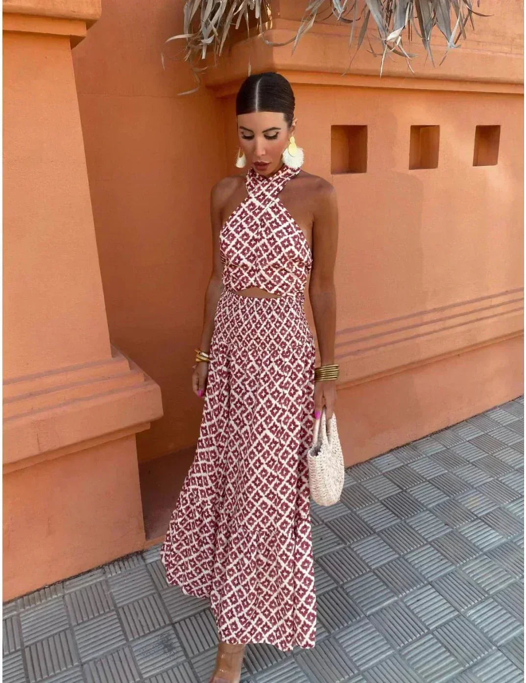 Sophisticated burgundy halter maxi dress with print. A stunning women's wedding guest dress, perfect for formal occasions.