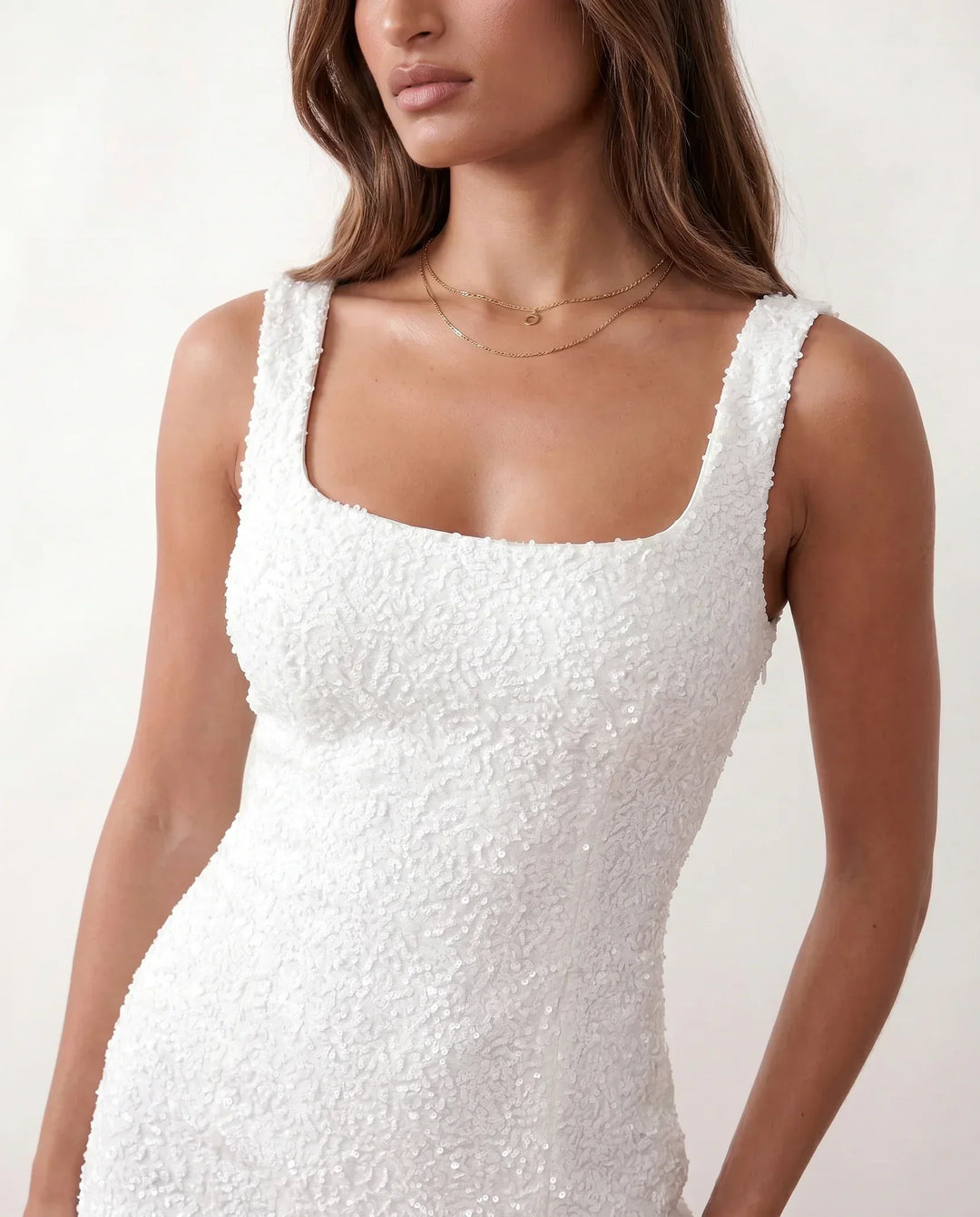 Chic shimmering cocktail mini dress for women, elegant square neck design for parties.