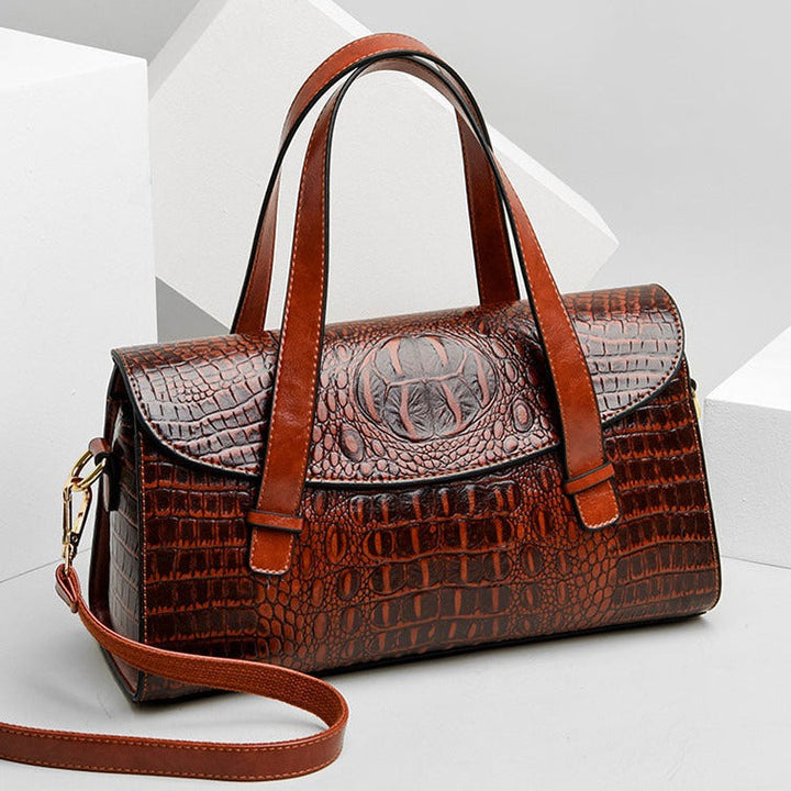Brown women's shoulder bag, featuring stylish crocodile texture and elegant embossed design. An everyday chic accessory.