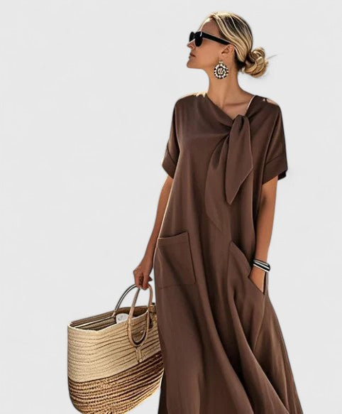Women's elegant summer midi dress, perfect day to evening. Flowy, chic style with pockets.
