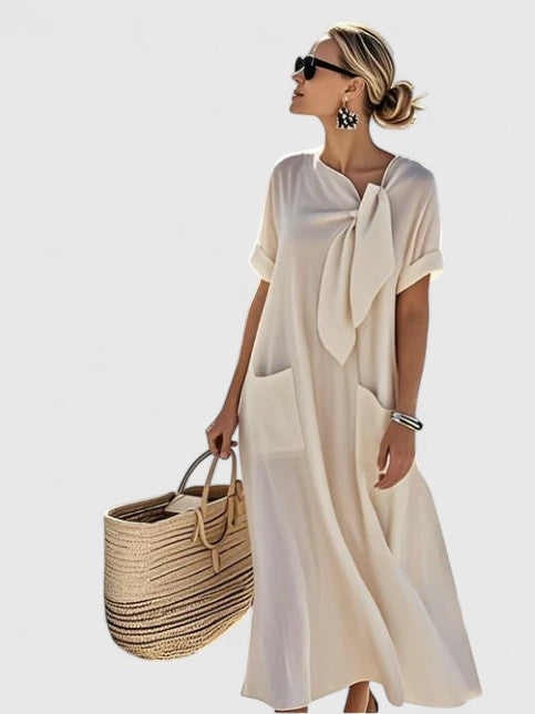 Effortless elegant women's summer midi dress, versatile for day to evening. Chic and comfortable.