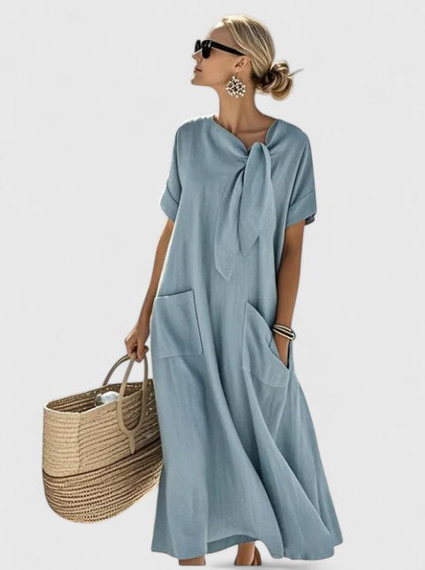 Flowy women's summer travel dress with pockets. Casual yet chic, ideal for effortless day to evening wear.