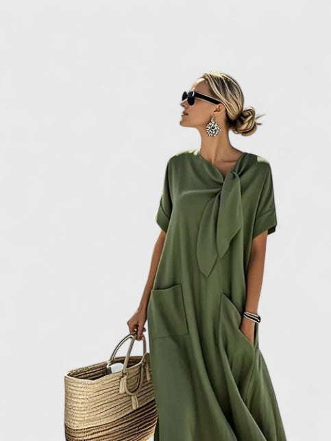 Women's elegant summer midi dress, flowy and comfortable for day to evening. Chic casual travel style with pockets.