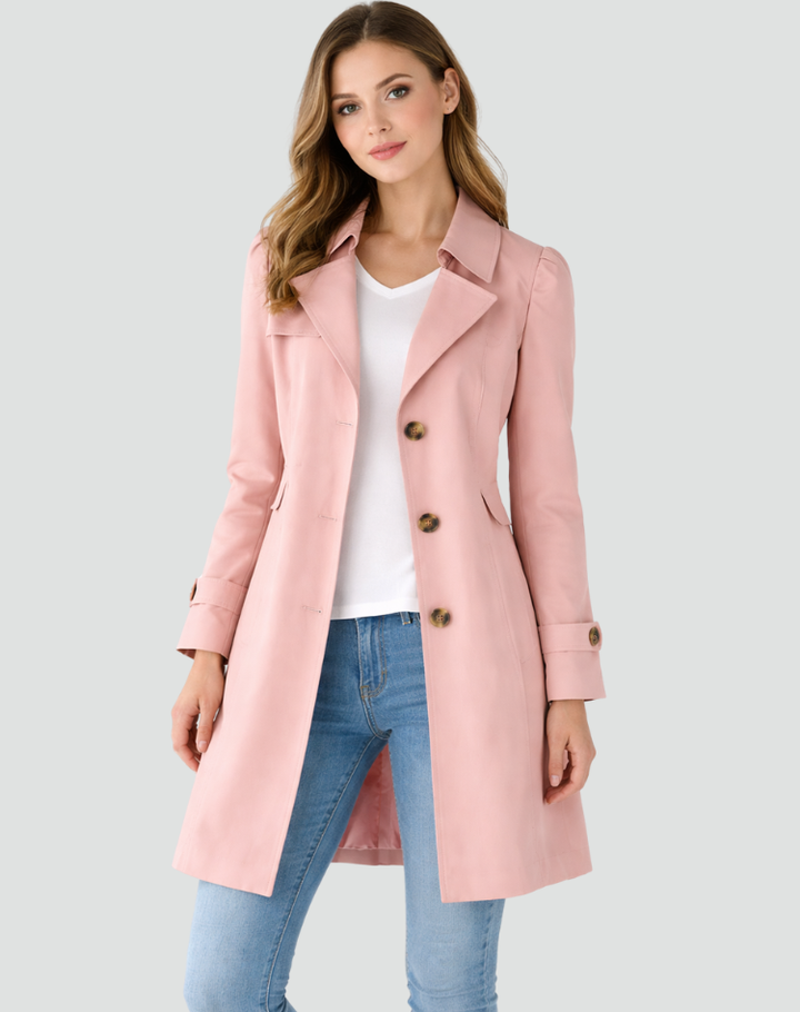 Modern classic women's tailored trench coat. Sophisticated long sleeve outerwear, perfect for elegant fall fashion.