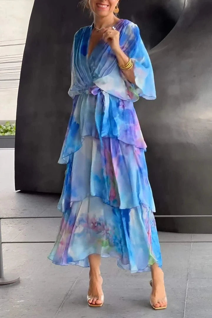Women's elegant tiered wrap dress with a chic print, perfect for evening events and special occasions.