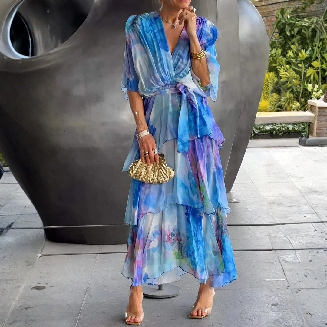 Long formal tiered wrap dress for women, ideal as a wedding guest gown or for a party.