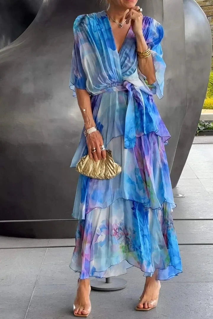 Printed tiered wrap evening gown for women, featuring a beautiful pattern and flowing silhouette.