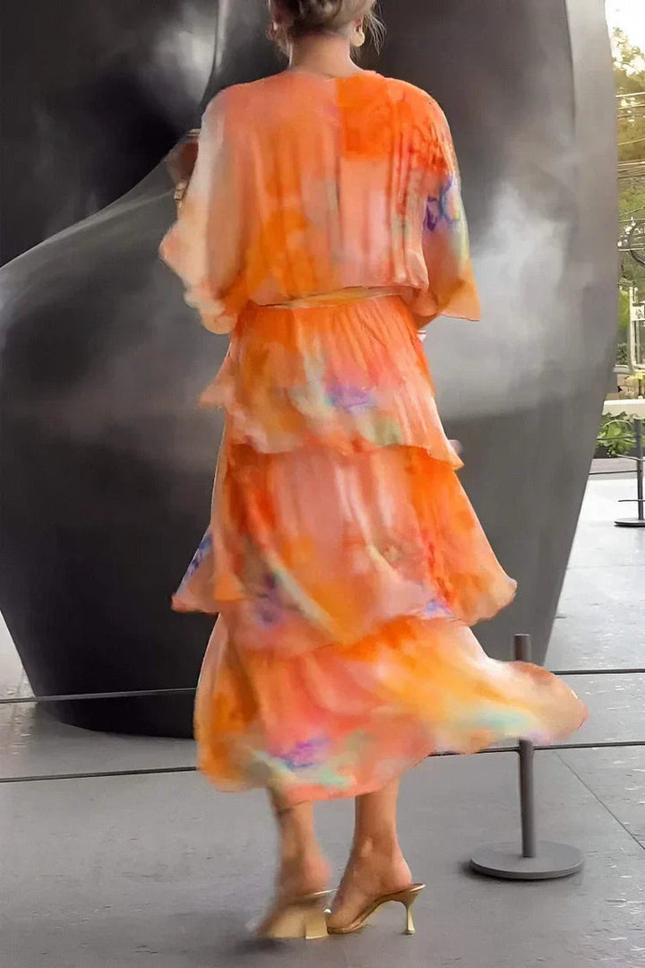 Fashionable women's evening gown, a long printed tiered wrap dress with a stylish silhouette.