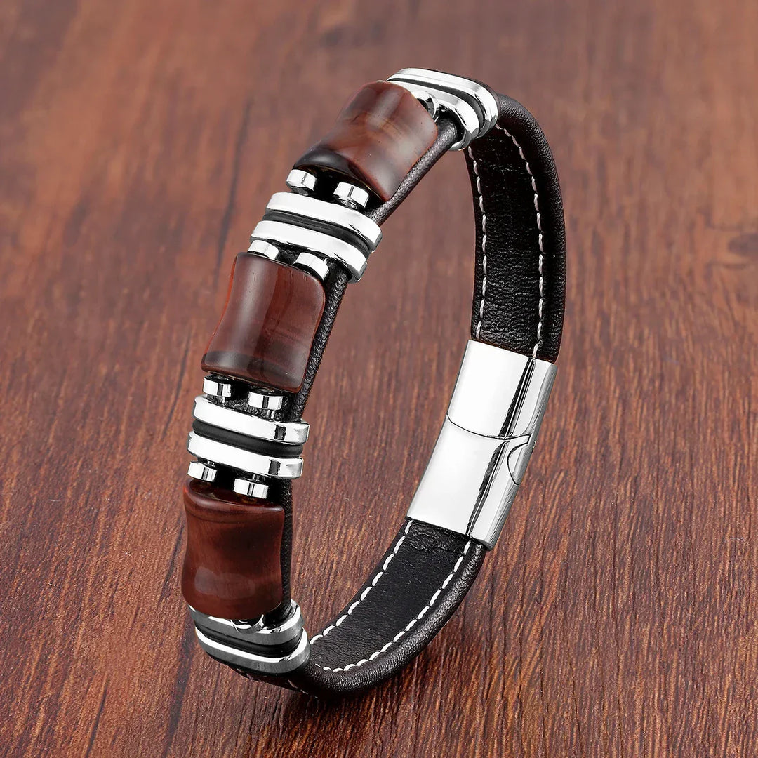 Woman's wrist wearing an adjustable Tiger's Eye natural stone bracelet. Grounding, elegant gemstone jewelry.
