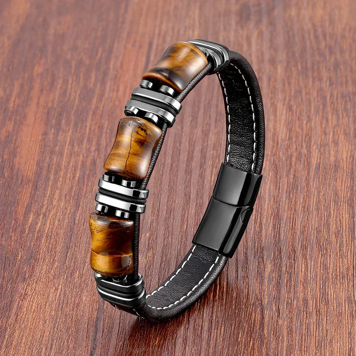 Detail shot of the polished Tiger's Eye beads on an elegant women's bracelet, showcasing natural patterns.