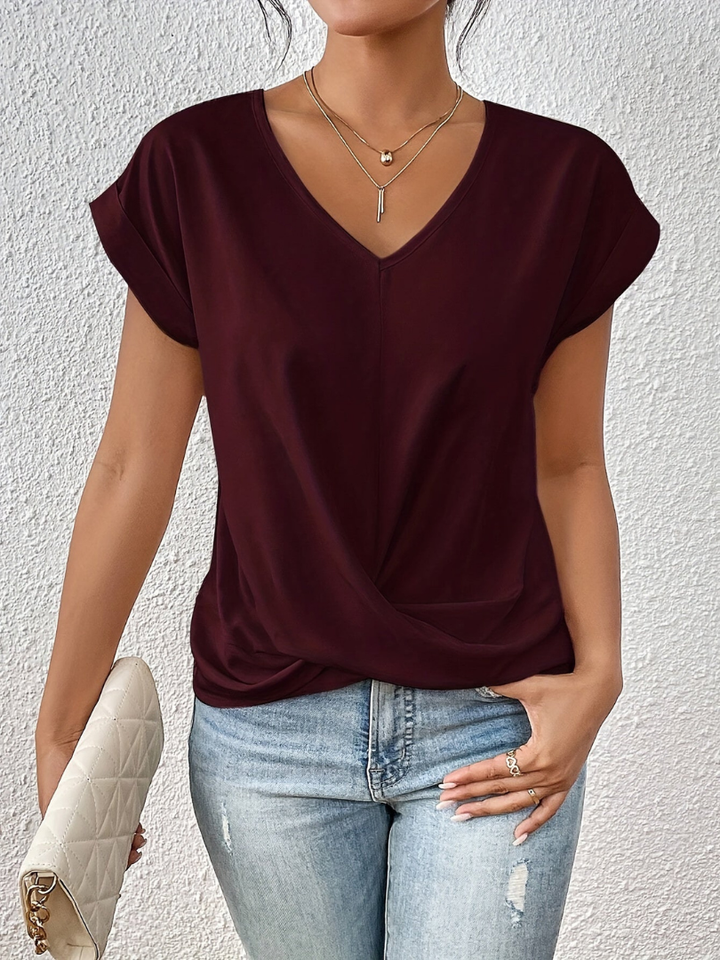 Office wear women's V-neck top. Short sleeve twist-front blouse for a polished, elegant look.