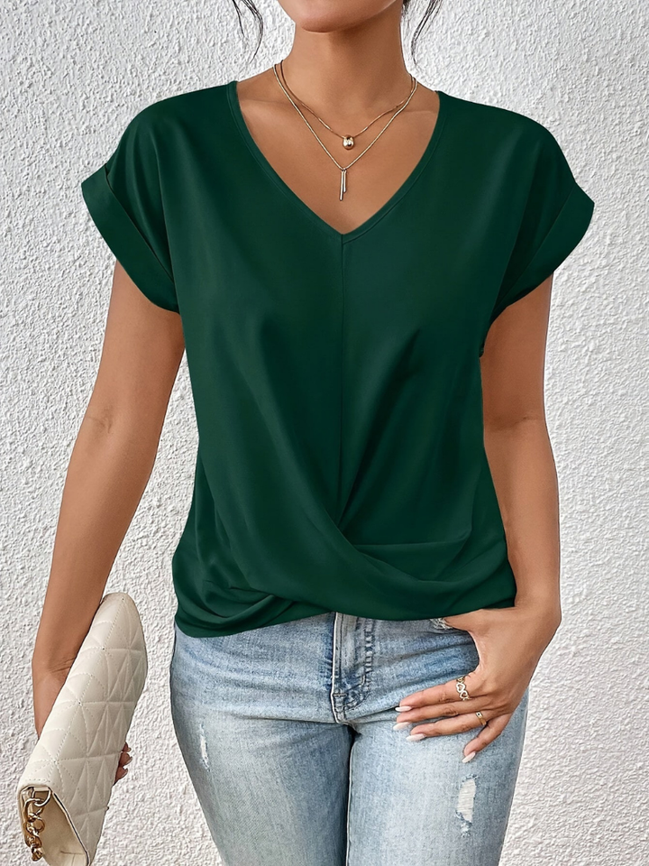 Elegant short sleeve women's top. Twist-front V-neck blouse, great for office or evening wear.