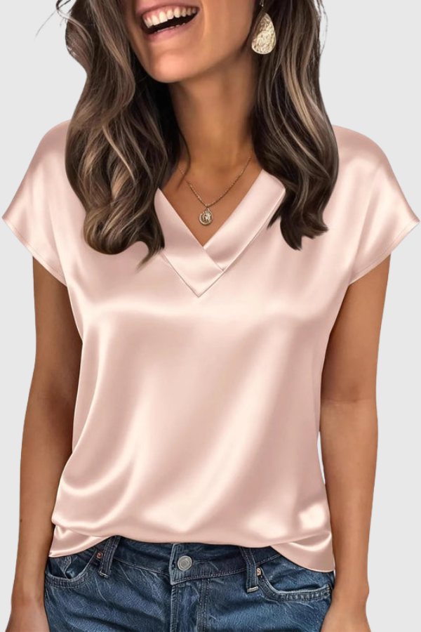 Women's elegant V-neck blouse, perfect for summer style. Short-sleeve, relaxed fit top for casual chic or work.