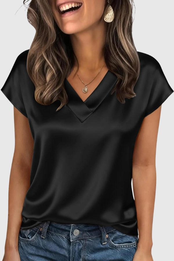 Versatile women's V-neck blouse, ideal for everyday summer wear. Elegant, relaxed fit ladies' top with short sleeves.