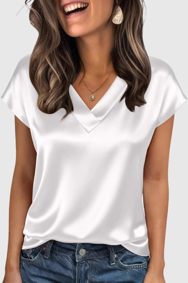 Fashionable ladies' V-neck blouse. Elegant short-sleeve summer top with a relaxed fit, perfect for versatile styling.