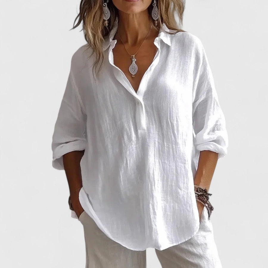 Stylish women's long sleeve V-neck blouse with a relaxed, comfortable fit. Elegant and versatile for any season.